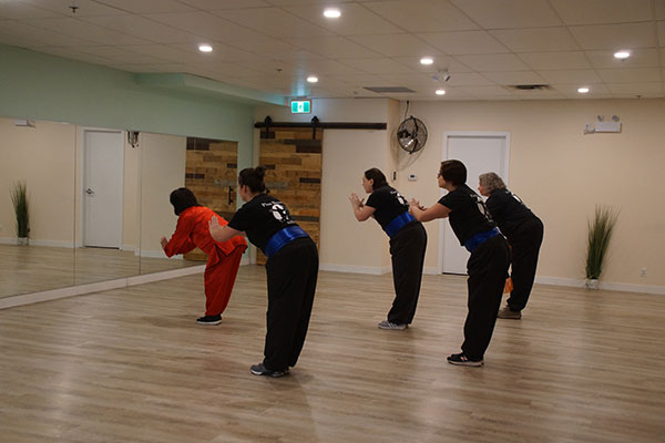 Plum Blossom Tai Chi Airdrie student attending the intermediate level class.